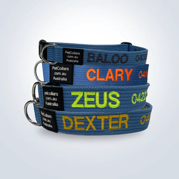 a stack of personalised pet collars in sky blue color with embroidered pet names